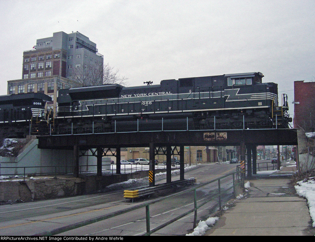 NS 1066 in profile above 2nd St. as 284 departs the yard